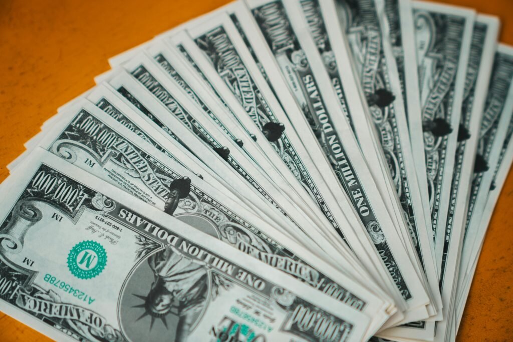 Who am I now? Closeup of novelty one million dollar bills laid out in a fan arrangement.