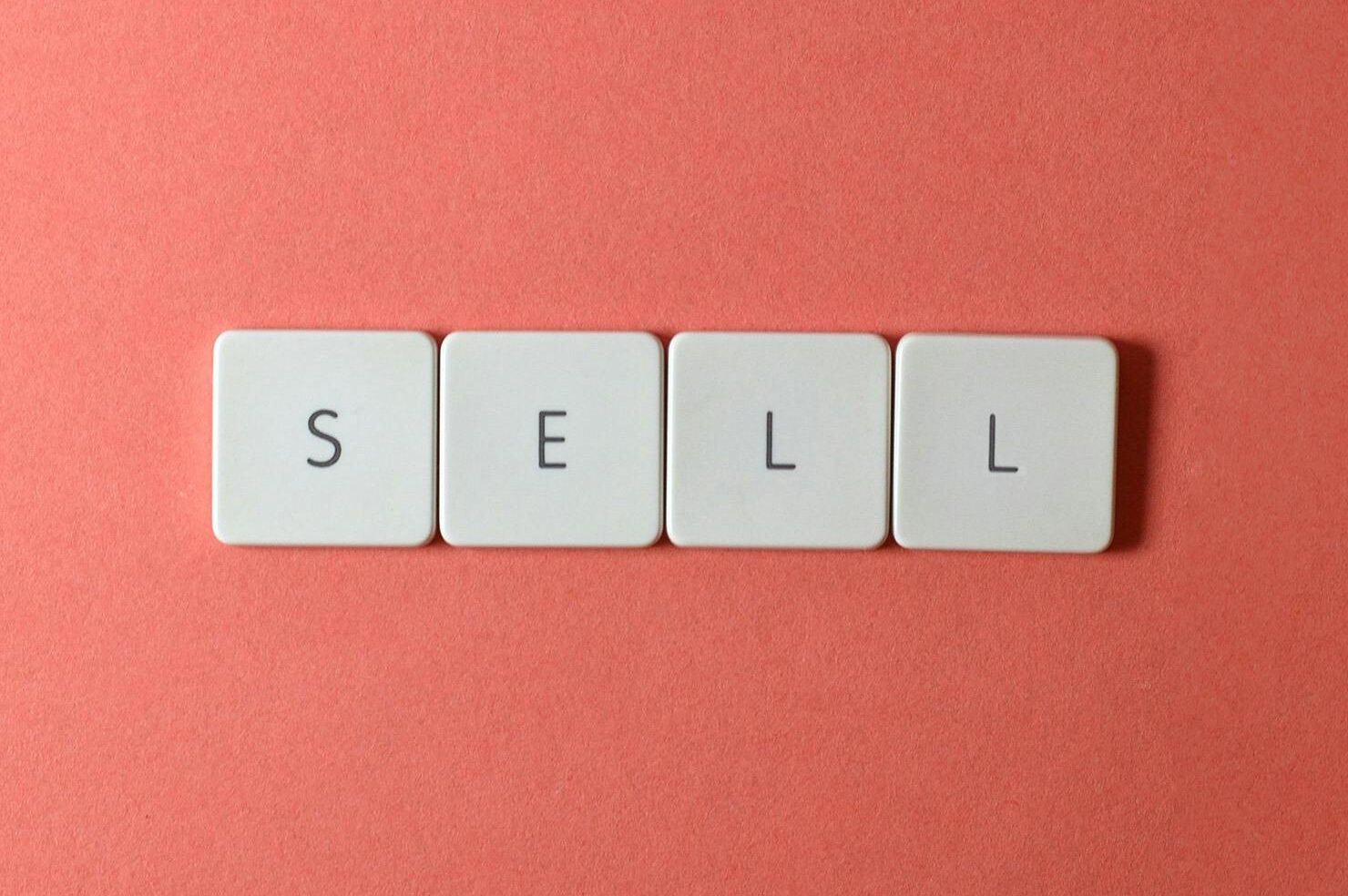 Who am I now? Close-up of keyboard tiles spelling
